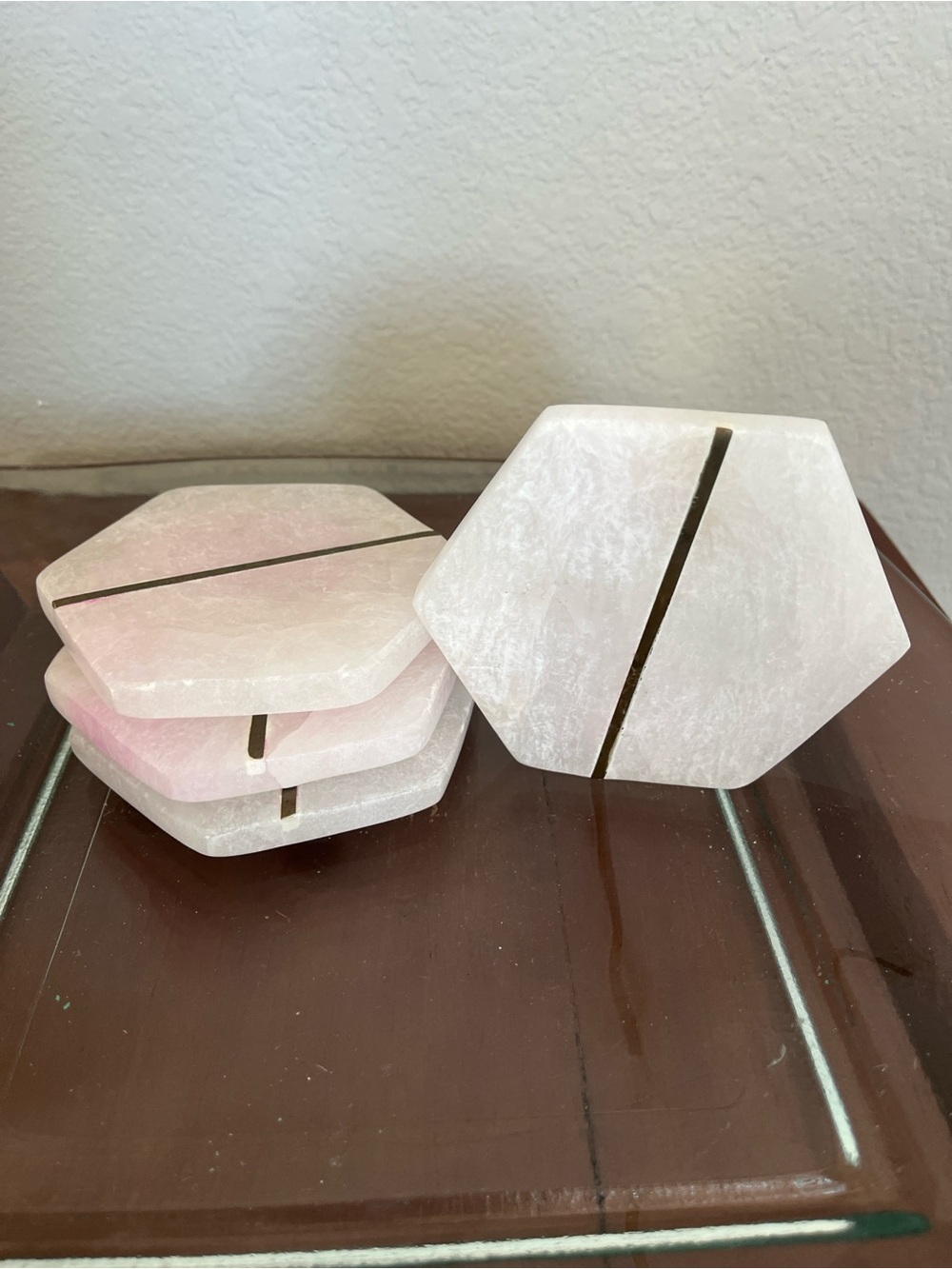 West Elm pink alabaster and brass hexagonal coasters with brass detail